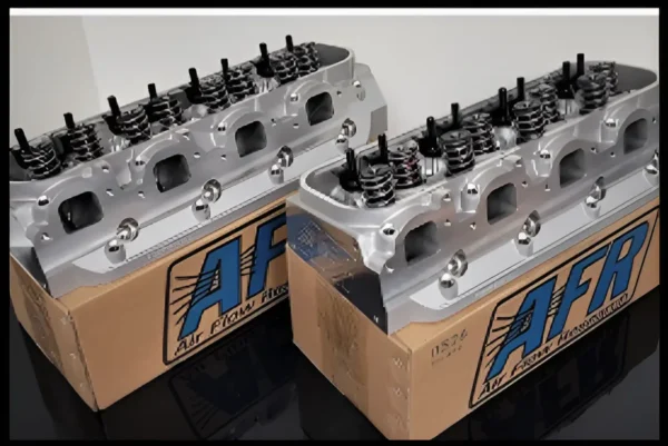 Here's an alt tag for the image: Two AFR cylinder heads in boxes.